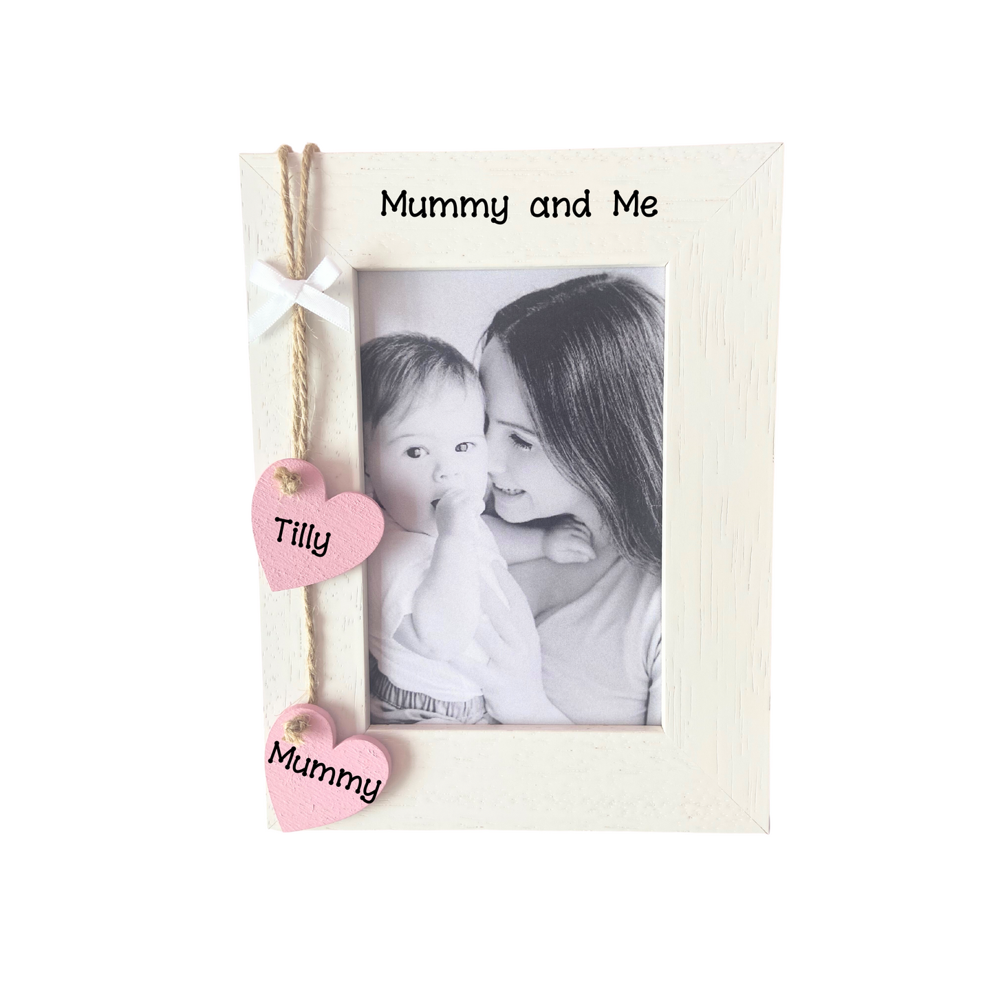 Image shows mummy and me photo frame, includes two hanging hearts with names and also small white bow above. Bling can be added.