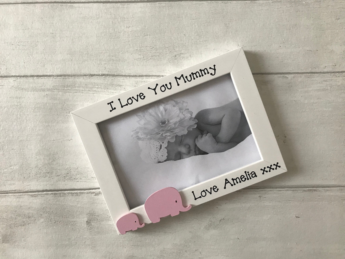 Image shows i love my mummy photo frame with baby and mummy elephant, with child's name along the bottom.