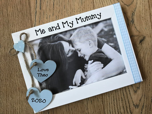 Image shows gingham design for a photo frame for a mum, includes two hanging hearts with child's name and year.